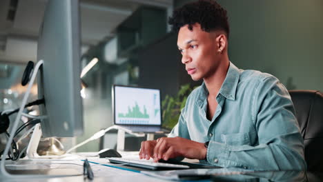 businessman working on financial data at night