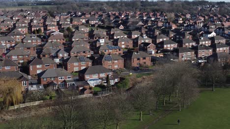 suburban neighbourhood merseyside residential homes rooftops real estate property aerial low orbit slow right view
