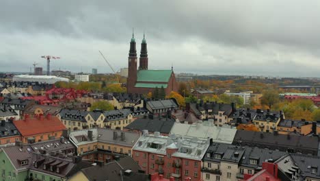 högalid church aerial cityscape in stockholm sweden, dolly out landscape drone view