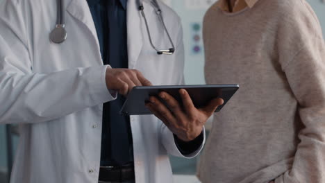 doctor consulting with patient using tablet