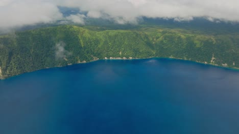 aerial drone view of lake mashu, the clearest crater lake in hokkaidō, japan