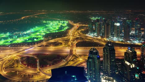 dubai night illumination traffic road junction roof panorama 4k time lapse united arab emirates