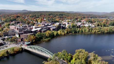 High aerial over the Connecticut River to Brattleboro Vermont