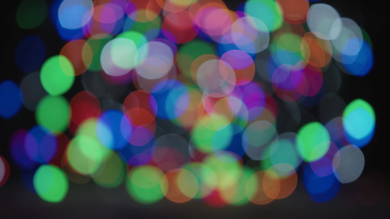 fondo abstracto con círculos bokeh multicolores. decoración navideña. bucle sin costuras. 4k
