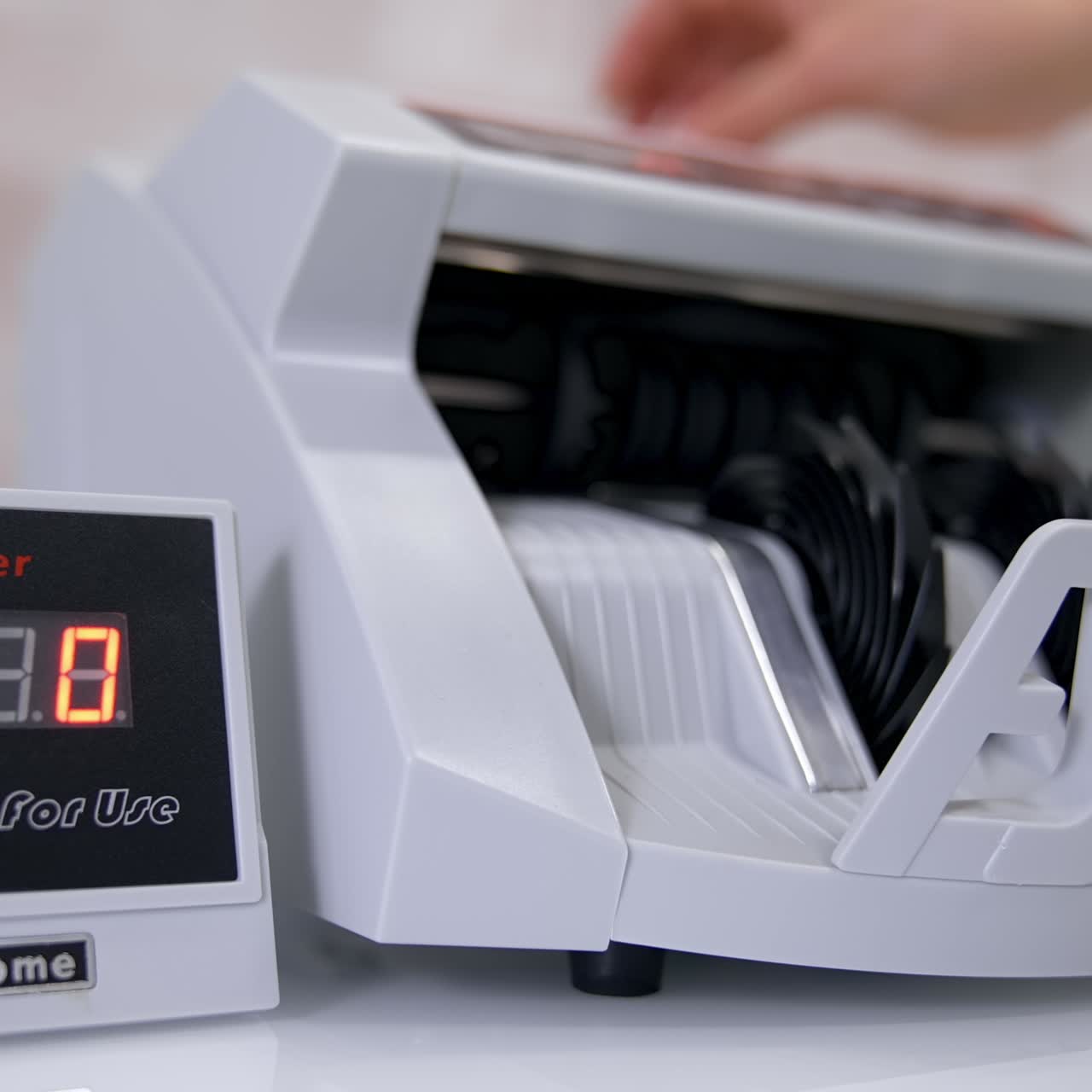 Euro bills going through the counting mechanism, close up