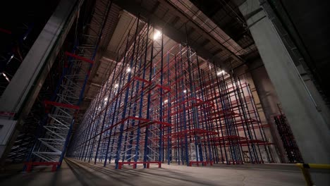 big and modern warehouse under construction, featuring metal shelving and other industrial equipment.