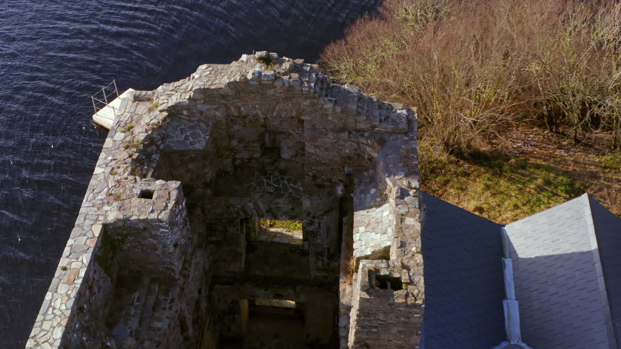 Dynamic top-down aerial shot of O'Flaherty Castle, highlighting the details of this 16th-century heritage site