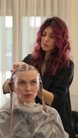 woman at a professional hairdresser during hair coloring