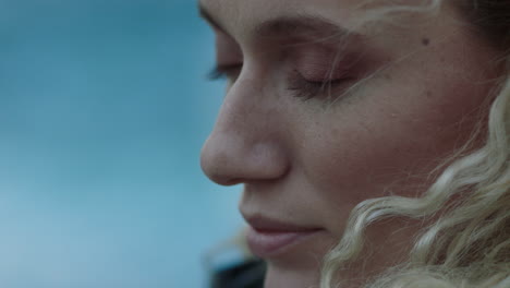 close up portrait of beautiful woman peaceful contemplating journey exploring spirituality feeling freedom with wind blowing hair