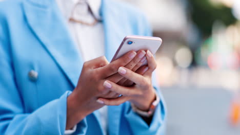 business woman, hands and phone typing in the city