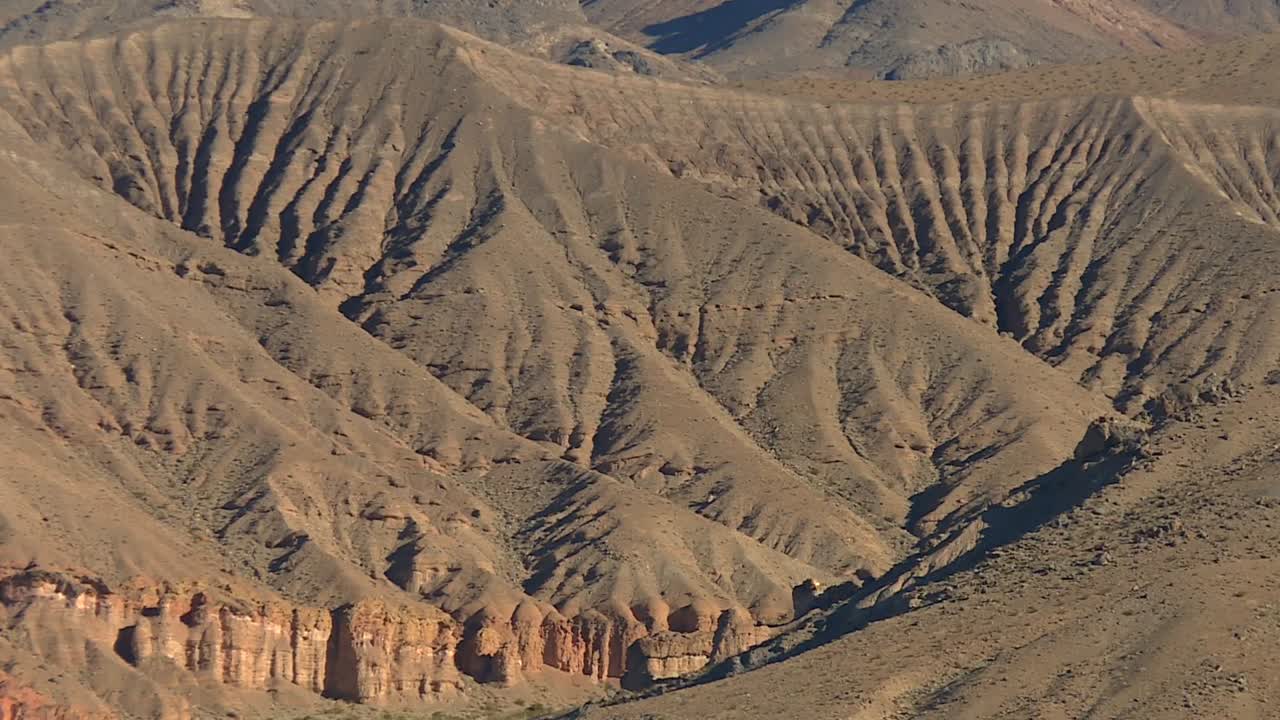 Sandstone Mountains In The Arid Deserts Of Death Valley National Park, USA. Aerial Shot