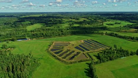 aerial view of pools for fish farming through fields