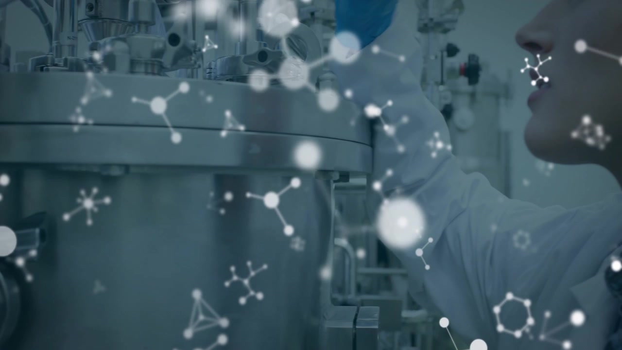 Lab tech turning valve key loosening clamp for port inspection in pharma lab with molecules