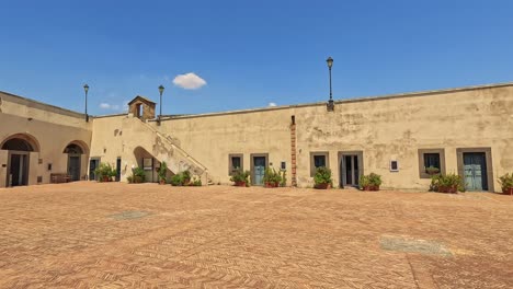 quiet courtyard with historic architecture and blue sky