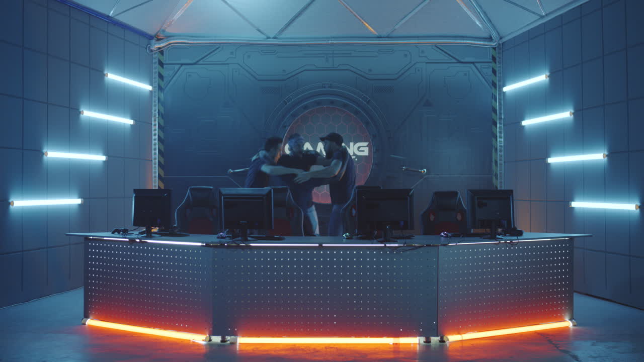 Gaming Team Sitting down at Computers Medium Closeup of a Team Sitting down at their Computers at a Gaming Tournament