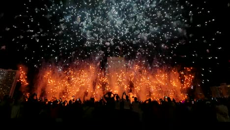 firework celebration new year 2020 , crowd watching fireworks celebration, background festive new year celebration with colorful fireworks.