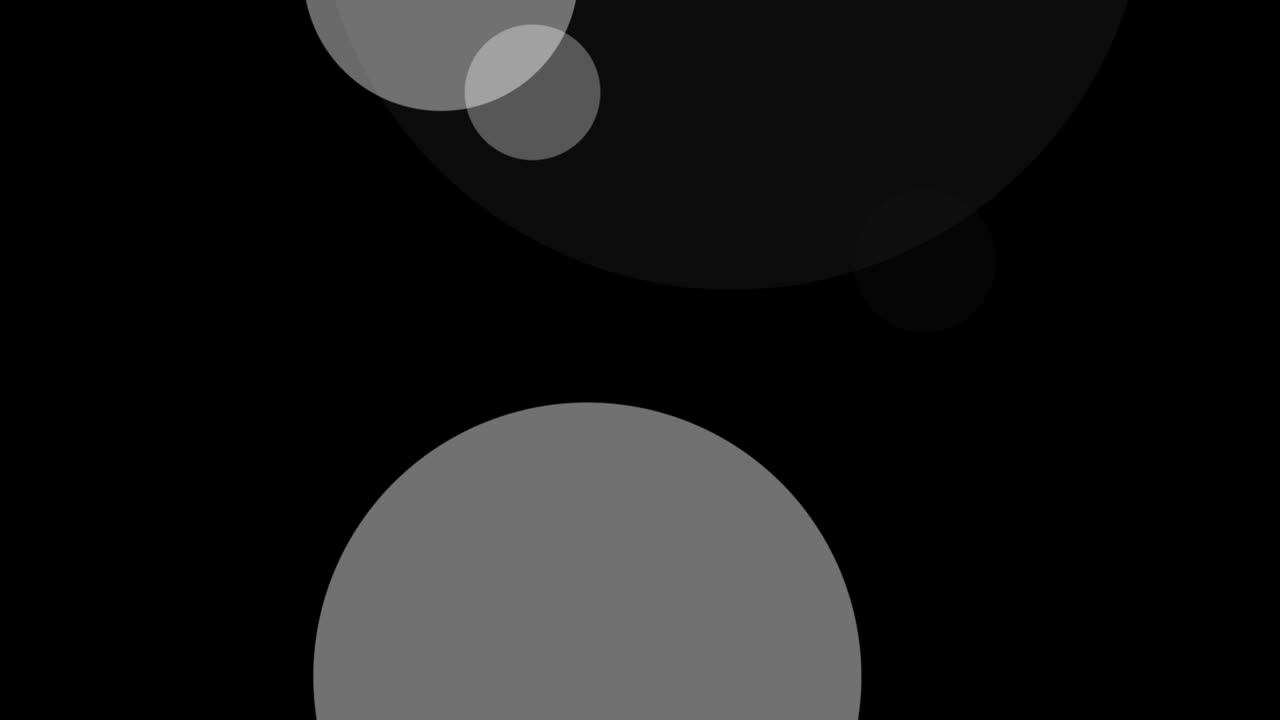 Abstract animation of white and gray bokeh circles floating on black background. For creating dreamy, soft, or atmospheric visuals