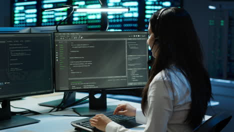 worker in server farm establishment oversees infrastructure systems