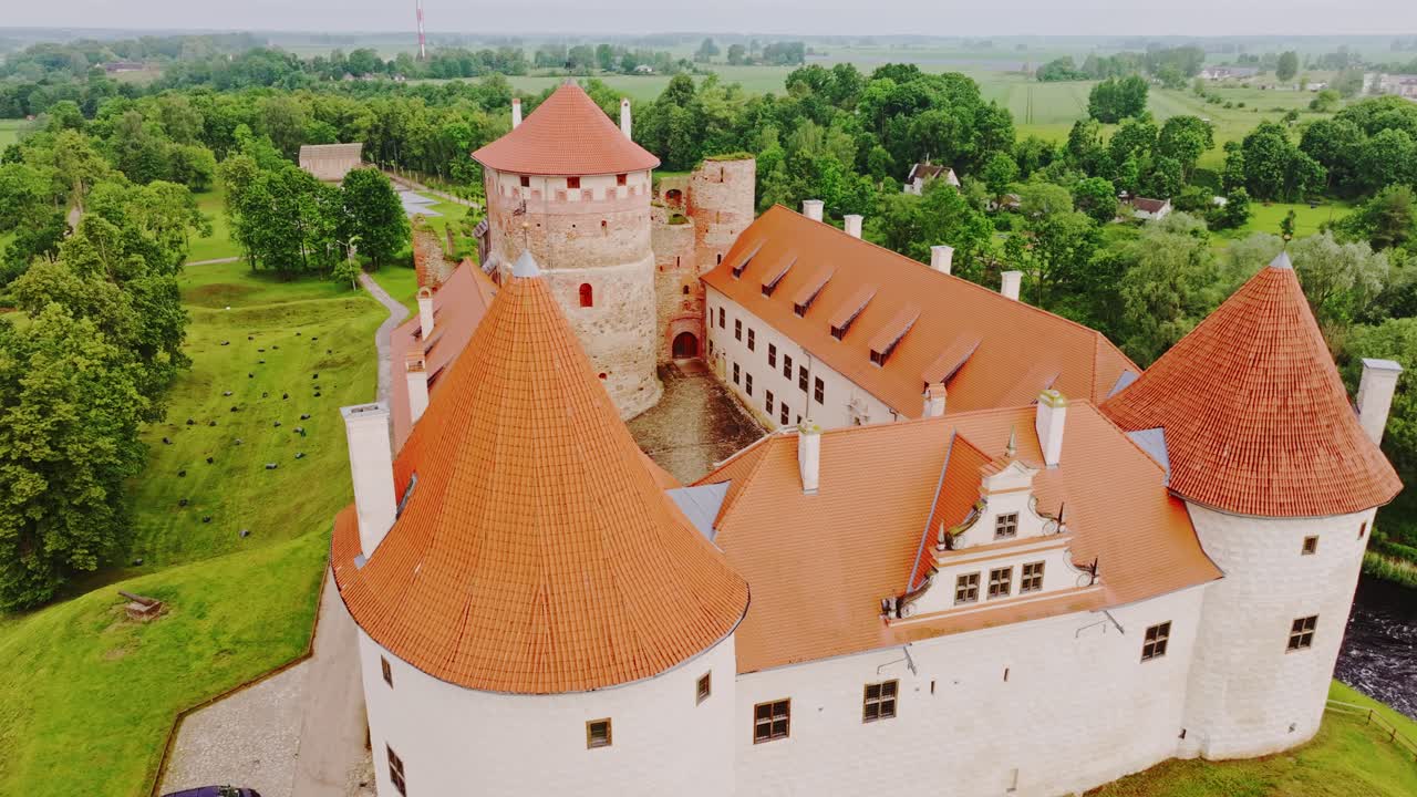 Aerial Of Bauska Castle Ruins And Restored Fortress Walls In Green Landscape