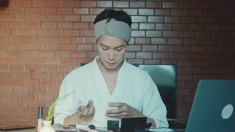 person applying makeup at home