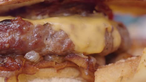 close-up of a delicious cheeseburger with melted cheese and caramelized onions