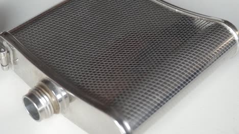 close-up of a stainless steel flask on a white background