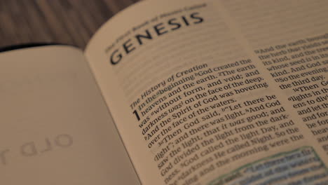 close up of genesis 1:1 in the holy bible