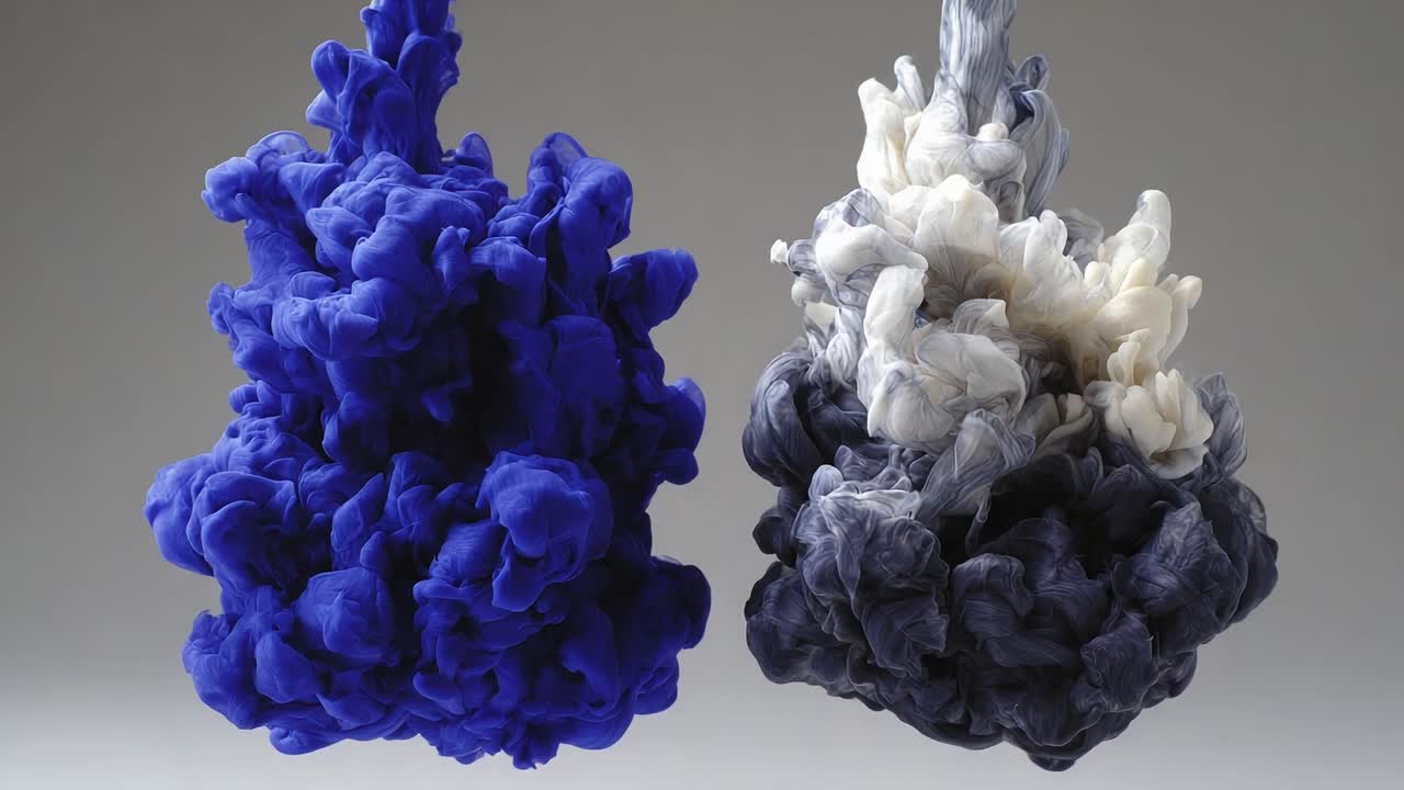 A Captivating Display of Fluid Dynamics: Vivid Blue and White Ink Swirling Together in Abstract Forms, Creating a Mesmerizing Visual Experience in Transformation