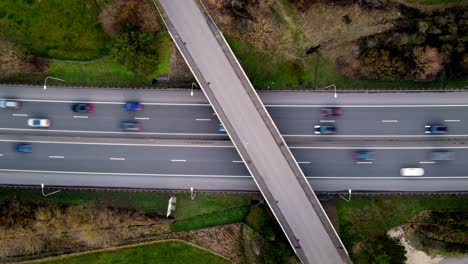 Timelapse-Aerial-drone-shot-over-highway-in-Luxembourg-in-traffic-hour
