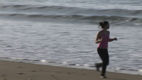 woman jogging on beach