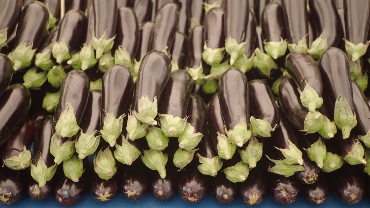 A large display of fresh eggplants