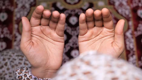 top view of muslim women hands praying.