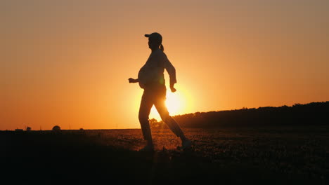 woman enjoying a sunset walk in a field