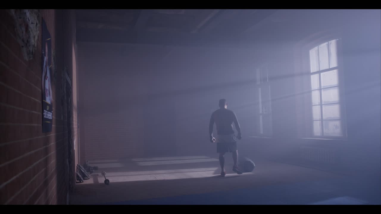 Man Training in a Boxing Gym
