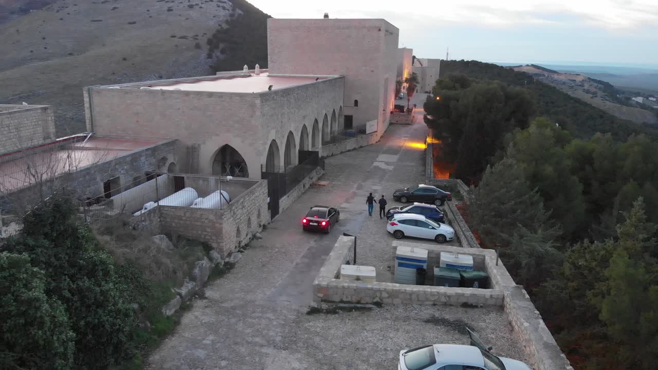 Jaen's Castle Saint Catalina Castle Spain shoot with a drone at 4k 24fps showing the exterior and the city from multiple points on a afternoon in December.