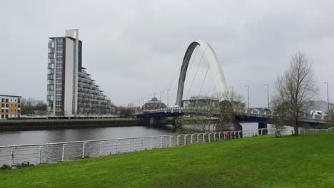 clyde arc bridge over river clyde with riverside apartments in glasgow, scotland uk