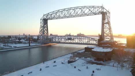 winter sunset at canal park bridge, duluth, minnesota