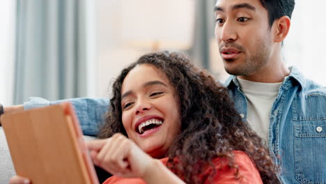 Tablet,-relax-and-couple-on-a-sofa-smile