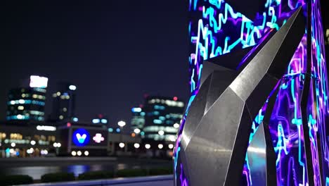 modern illuminated sculpture at night