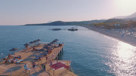 luxury beach resort with pier and people