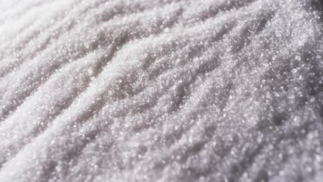 Video-of-close-up-of-white-sand-grains-with-pattern-and-copy-space-background