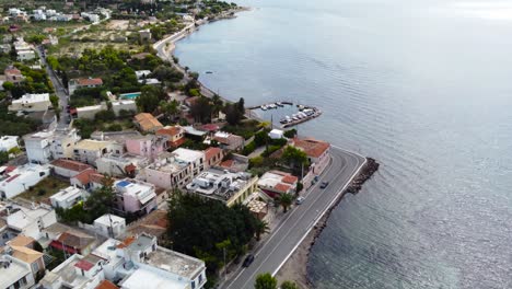 bird's eye view photo of boats docked in paradise island of moni next to aigina with emerald crystal clear waters, saronic gulf, greece