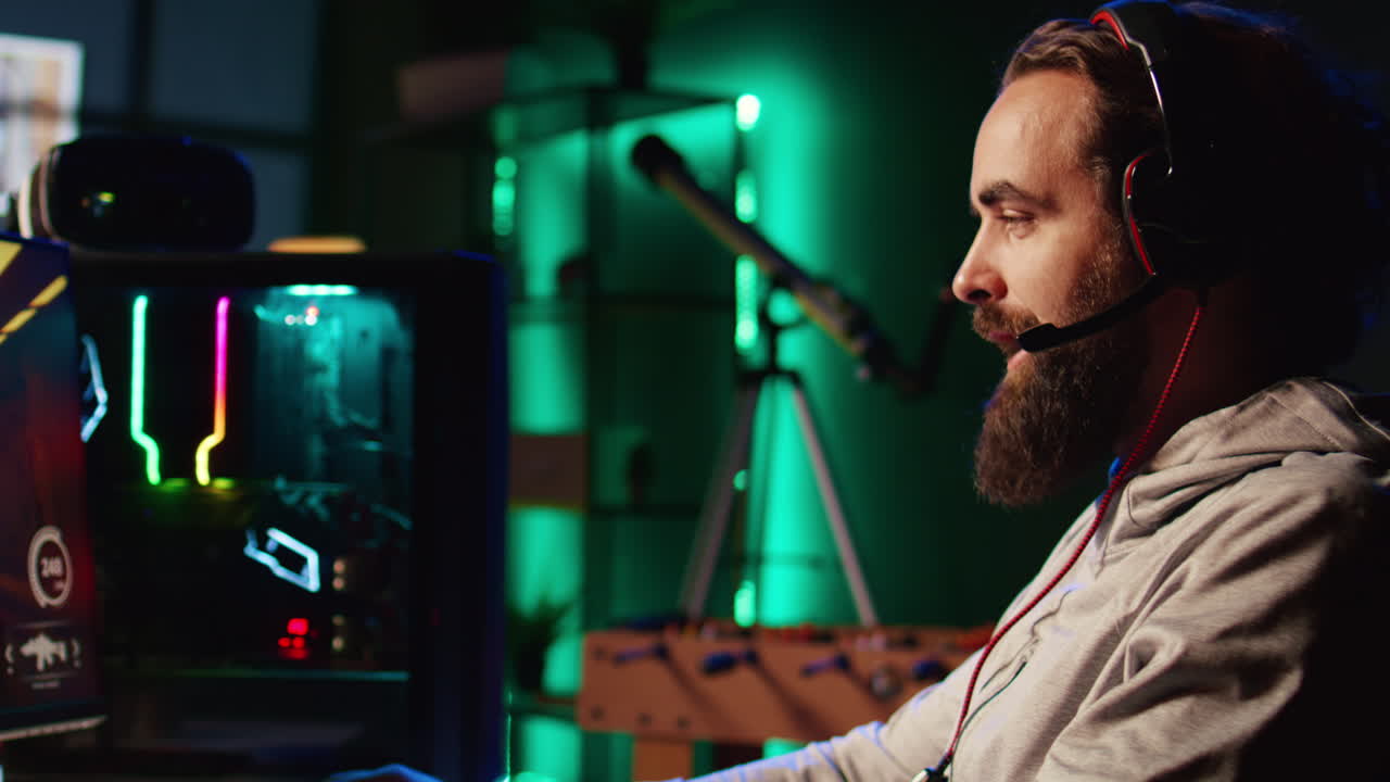 Man enjoying competitive online FPS videogame, battling flying robots with his friends