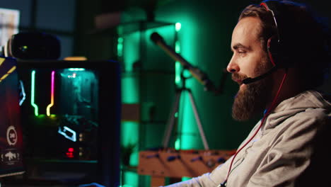 man enjoying competitive online fps videogame, battling flying robots with his friends