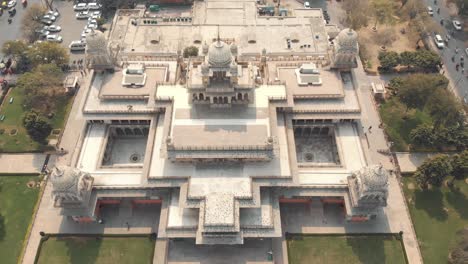 albert hall museum architecture marvellous in the center of jaipur, rajasthan, india - aerial fly-over tilt-down reveal