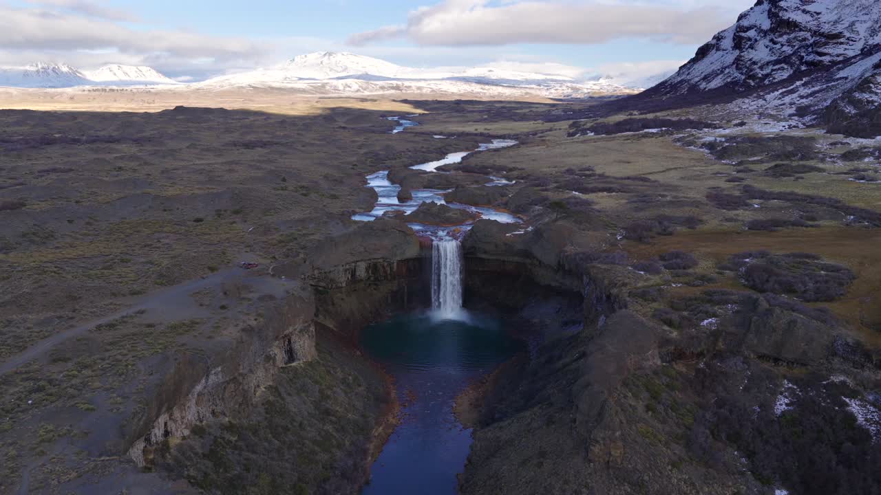Aerial drone view revealing Salto del Agrio waterfall and surrounding volcanic landscape in Caviahue, Neuquén Province, Argentina