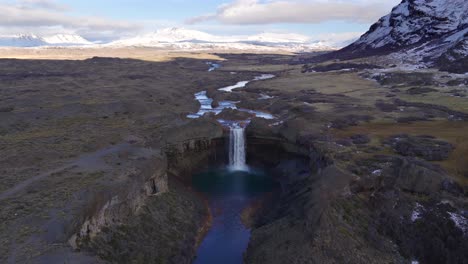 aerial drone view revealing salto del agrio waterfall and surrounding volcanic landscape in caviahue, neuquén province, argentina