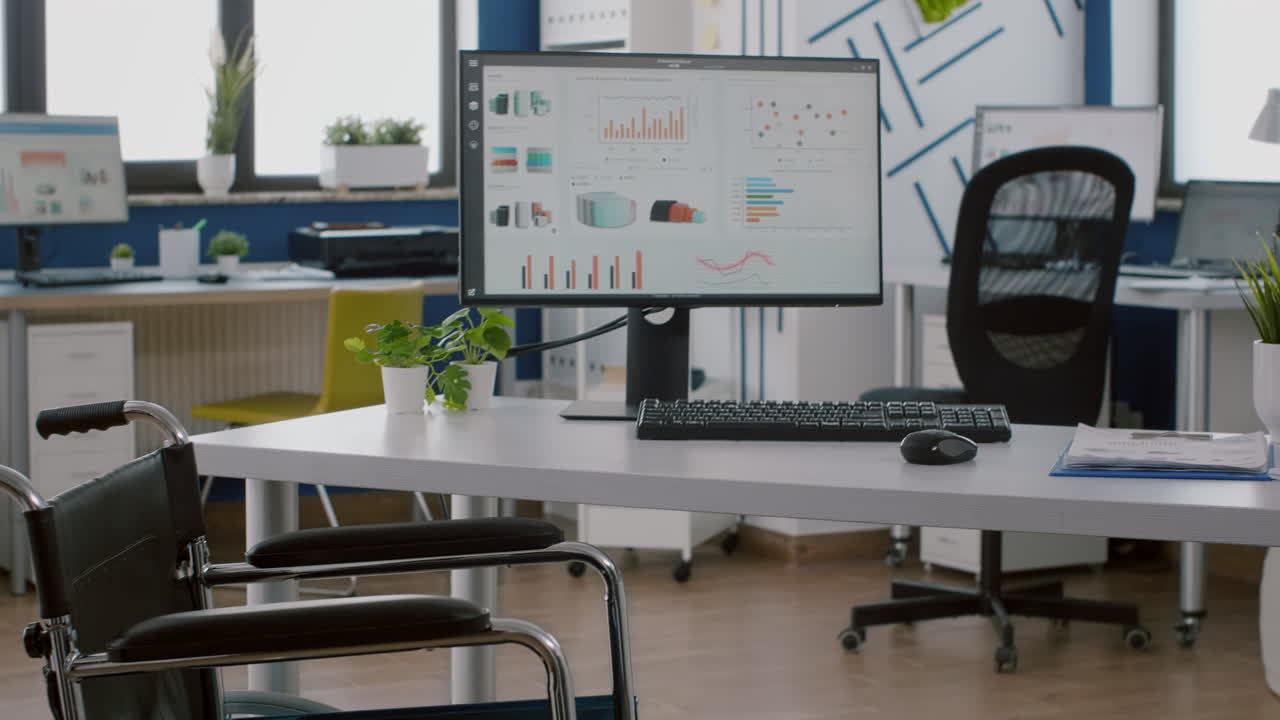 Wheelchair for handicapped employees placed inmodern empty workspace