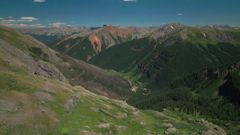 aerial drone cinematic ice lake basin trail hike silverton ouray red mountain pass colorado dreamy heavenly rocky mountain scene lush green wildflower summer snow melting rocky peaks circle movement