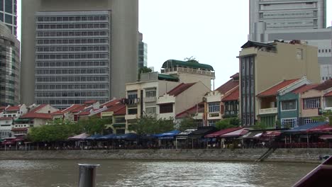 small buildings alongside singapore river